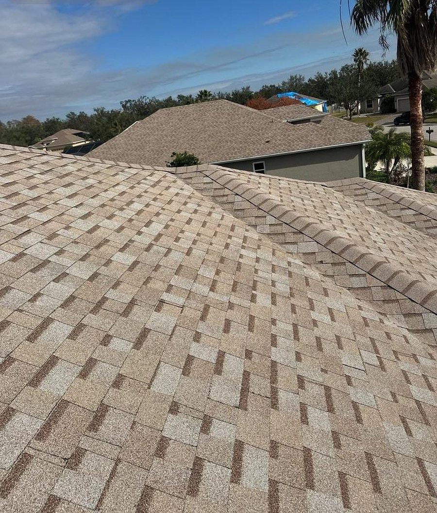 A home re-roofed in a light-toned shingle
