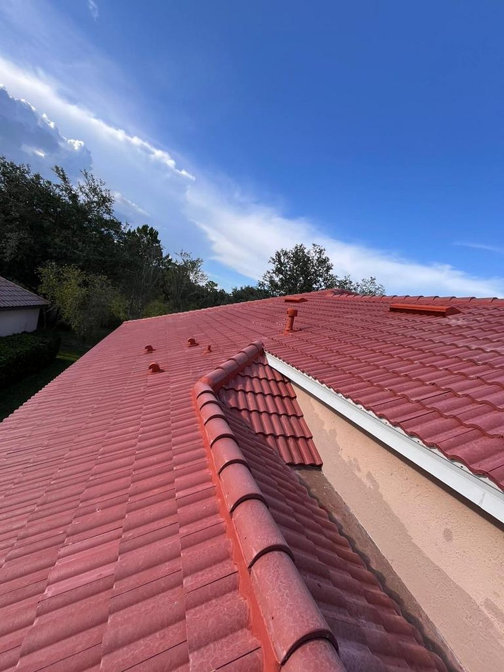 Ridge line of a red barrel tile roof